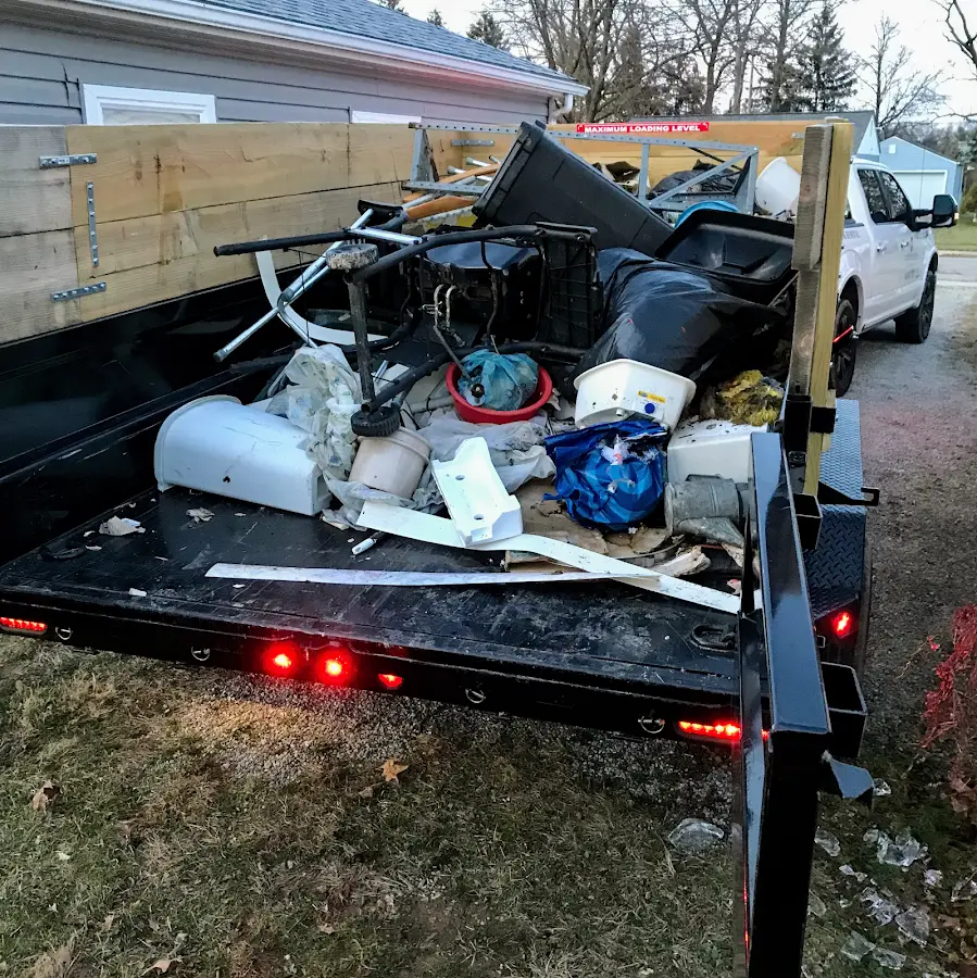 Roll-off dumpster delivered to a residential driveway in Southold
